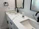 Bright bathroom features dual sinks, modern fixtures, and sleek countertops for a contemporary feel at 202 Bromwich Dr, Kissimmee, FL 34758