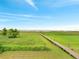 Pathway to a distant dock, inviting you to explore the waterfront of this expansive backyard at 2525 Ridgeway Dr, Kissimmee, FL 34746