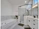 Bathroom with a large soaking tub, frameless shower, and dual sinks, offering a spa-like experience at 2525 Ridgeway Dr, Kissimmee, FL 34746