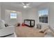 Bright Bedroom with chair, crib, natural light from two windows, and a plush, neutral-colored rug at 2525 Ridgeway Dr, Kissimmee, FL 34746