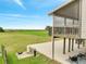 Spacious backyard view with a serene view and a glimpse of the second story screened in porch at 2525 Ridgeway Dr, Kissimmee, FL 34746