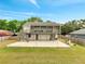 A two-story home with a large screened deck and patio providing ample outdoor living space at 2525 Ridgeway Dr, Kissimmee, FL 34746