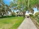 Spacious front yard and a long driveway leading to a charming two-story home at 2525 Ridgeway Dr, Kissimmee, FL 34746