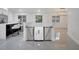 Open-concept foyer with a baby gate, marble floors and dining area at 2525 Ridgeway Dr, Kissimmee, FL 34746