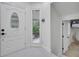 Elegant foyer with a decorative front door and tiled floors at 2525 Ridgeway Dr, Kissimmee, FL 34746