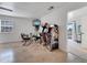 Game room boasting arcade games, table and chairs with a view of the backyard through the sliding glass doors at 2525 Ridgeway Dr, Kissimmee, FL 34746