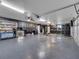 Spacious garage with epoxy flooring and ample storage space is ready for vehicle storage and DIY projects at 2525 Ridgeway Dr, Kissimmee, FL 34746
