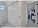 Hallway featuring modern lighting, a closet, bright paint, and clean lines leading to an adjacent room at 2525 Ridgeway Dr, Kissimmee, FL 34746