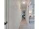 Hallway featuring modern lighting, clean lines, and bright paint leading into adjacent rooms at 2525 Ridgeway Dr, Kissimmee, FL 34746