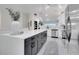 Modern kitchen featuring a large island with sleek cabinetry and a seamless transition to the living area at 2525 Ridgeway Dr, Kissimmee, FL 34746