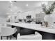 Bright, modern kitchen features white cabinets, stainless steel appliances, and a large island with bar seating at 2525 Ridgeway Dr, Kissimmee, FL 34746