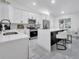 Contemporary kitchen with white cabinets, stainless steel appliances, and a center island with seating at 2525 Ridgeway Dr, Kissimmee, FL 34746