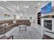 Bright living room with high ceilings, fireplace, and a large comfortable couch at 2525 Ridgeway Dr, Kissimmee, FL 34746