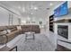 Spacious living room featuring a comfortable brown sectional sofa and a modern fireplace with a TV mounted above at 2525 Ridgeway Dr, Kissimmee, FL 34746
