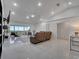 Spacious living room with a view of the water and vaulted ceiling at 2525 Ridgeway Dr, Kissimmee, FL 34746