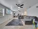 Large living room with a comfortable sectional sofa, games, and tile flooring at 2525 Ridgeway Dr, Kissimmee, FL 34746
