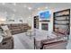 Living room with a fireplace, shelving and comfy seating at 2525 Ridgeway Dr, Kissimmee, FL 34746