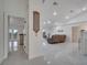 Bright, open living room with modern tile flooring, high ceilings, and ample natural light creating an inviting space at 2525 Ridgeway Dr, Kissimmee, FL 34746