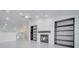Open-concept living room with fireplace, built-in shelving, and a ceiling fan for added comfort at 2525 Ridgeway Dr, Kissimmee, FL 34746