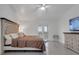 This is a spacious main bedroom with outdoor access, a ceiling fan, and TV for entertainment at 2525 Ridgeway Dr, Kissimmee, FL 34746