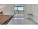 Bright main bedroom with outdoor access with views of the lush landscaping and surrounding landscape at 2525 Ridgeway Dr, Kissimmee, FL 34746