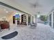 Expansive screened-in porch connecting the interior living space with the outdoor scenery at 2525 Ridgeway Dr, Kissimmee, FL 34746