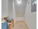 Walk-in storage area with tiled floor and built-in shelf provides ample space for organizing belongings at 2525 Ridgeway Dr, Kissimmee, FL 34746