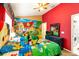 Fun bedroom with bright colors, themed decor, and two beds, perfect for  at 2585 Maneshaw Ln, Kissimmee, FL 34747