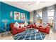 Bright living room with comfortable seating, modern decor, and an open layout for entertaining guests at 2585 Maneshaw Ln, Kissimmee, FL 34747