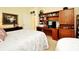 Bedroom with built in desk and shelves at 2591 Oneida Loop, Kissimmee, FL 34747