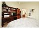 A bedroom is complete with a custom desk and an attached bathroom at 2591 Oneida Loop, Kissimmee, FL 34747