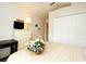 A bright bedroom with floral bedding, a white dresser, and a large closet at 2591 Oneida Loop, Kissimmee, FL 34747