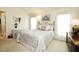 Relaxing bedroom with a metal bed frame, neutral walls, and ample natural light at 2591 Oneida Loop, Kissimmee, FL 34747