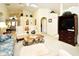 Inviting living room with vaulted ceilings, plush seating, and a decorative coffee table at 2591 Oneida Loop, Kissimmee, FL 34747