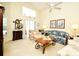 Spacious living room with vaulted ceilings, plush furnishings and large windows at 2591 Oneida Loop, Kissimmee, FL 34747