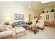 Open-concept living room with vaulted ceilings and an adjacent dining area, illuminated by natural light at 2591 Oneida Loop, Kissimmee, FL 34747