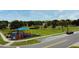 Neighborhood park featuring a playground, benches, and plenty of green space for outdoor enjoyment at 2591 Oneida Loop, Kissimmee, FL 34747