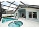 Beautiful screened-in pool and spa, perfect for relaxation and enjoying the outdoors at 2591 Oneida Loop, Kissimmee, FL 34747
