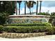 A welcoming entrance to Indian Creek with manicured landscaping and an attractive stone sign at 2591 Oneida Loop, Kissimmee, FL 34747