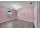 Bedroom with a chandelier and unique decor, including a painting of angel wings at 2824 Noble Crow Dr, Kissimmee, FL 34744