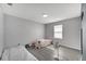 Comfortable bedroom with laminate floors, a large window, and minimal decor at 2824 Noble Crow Dr, Kissimmee, FL 34744