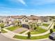 Stunning two-story home with a three-car garage and meticulously landscaped front yard at 2824 Noble Crow Dr, Kissimmee, FL 34744