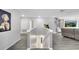 Upstairs living room with arcade game, entertainment center, and comfortable leather sofa at 2824 Noble Crow Dr, Kissimmee, FL 34744