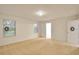 Large bedroom with neutral carpet, two windows and a walk-in closet at 2833 Noble Crow Dr, Kissimmee, FL 34744