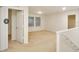 Bonus room with neutral carpet, two windows, two doors and staircase at 2833 Noble Crow Dr, Kissimmee, FL 34744