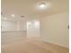 Carpeted loft area with natural light and views of the hallway at 2833 Noble Crow Dr, Kissimmee, FL 34744