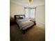 Relaxing bedroom with comfortable bed, soft lighting, and a cozy atmosphere at 2862 Grasmere View Pkwy, Kissimmee, FL 34746