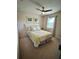 Bright bedroom featuring ceiling fan, comfortable bed, and natural light from the window at 2862 Grasmere View Pkwy, Kissimmee, FL 34746