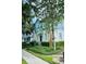 Inviting two-story home featuring blue and white exterior, manicured landscaping, and charming front entrance at 2862 Grasmere View Pkwy, Kissimmee, FL 34746