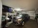 Full garage shot, SUV parked inside and overhead storage system installed at 2862 Grasmere View Pkwy, Kissimmee, FL 34746
